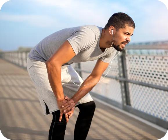 Man experiencing knee pain while running due to an ACL tear