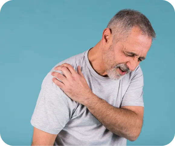 Man holding shoulder with acute AC joint pain, showing symptoms of acromioclavicular joint injury