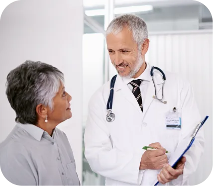 Elderly woman speaking with an orthopedic specialist about end stage knee osteoarthritis treatment options
