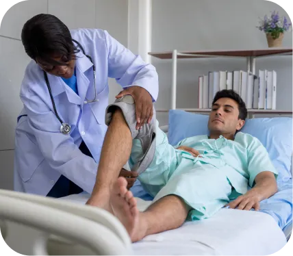Orthopedic doctor assessing a patient’s knee during postoperative evaluation for Lateral Patellofemoral Compressive Syndrome