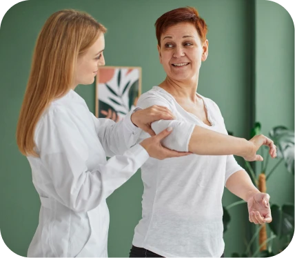 Woman receiving physical therapy for chronic lateral epicondylitis during an elbow rehabilitation session