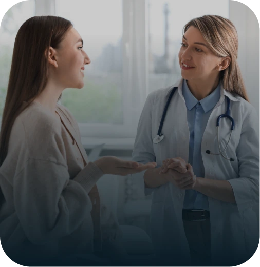 Medical assistant providing supportive care and guidance to a patient during an orthopedic consultation at The Joint Preservation Center.